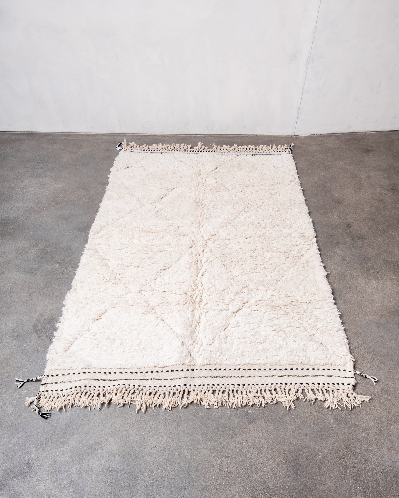 Modern, designer, handcrafted Berber rug from Morocco. Beniourain carpet with beautiful colours and patterns and fluffy wool texture.